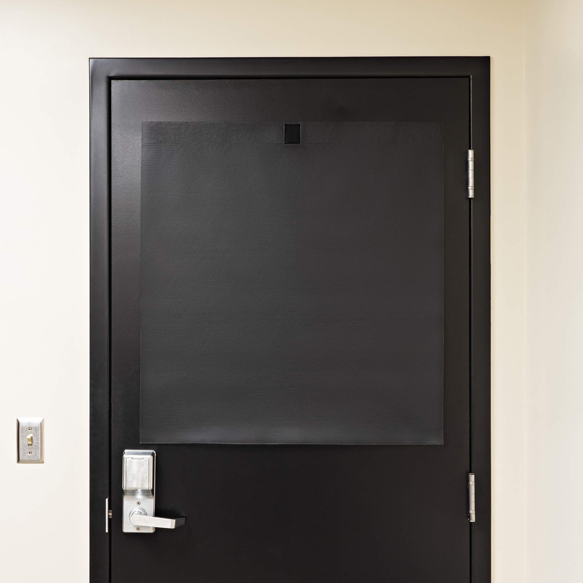 Installed ALP lockdown shade covering a classroom door window.
